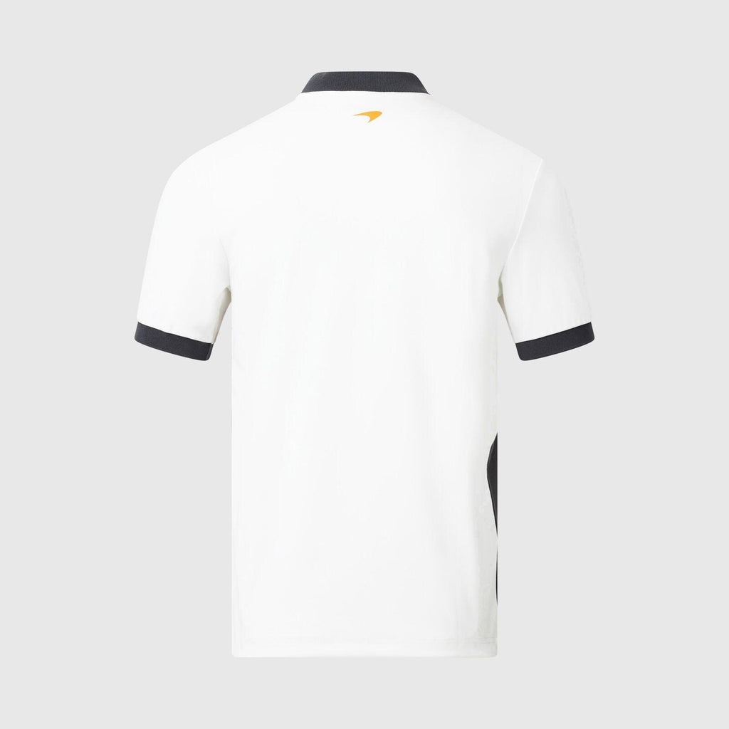 Back view of a white McLaren F1 Gulf polo shirt with black trim and gold logo.