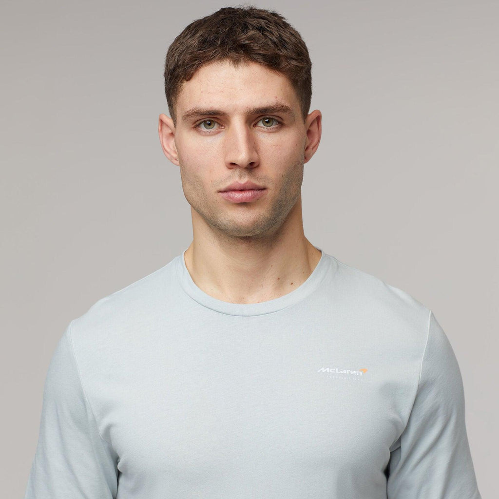 Man wearing a light blue McLaren F1 Lando Norris Core Essentials T-shirt.
