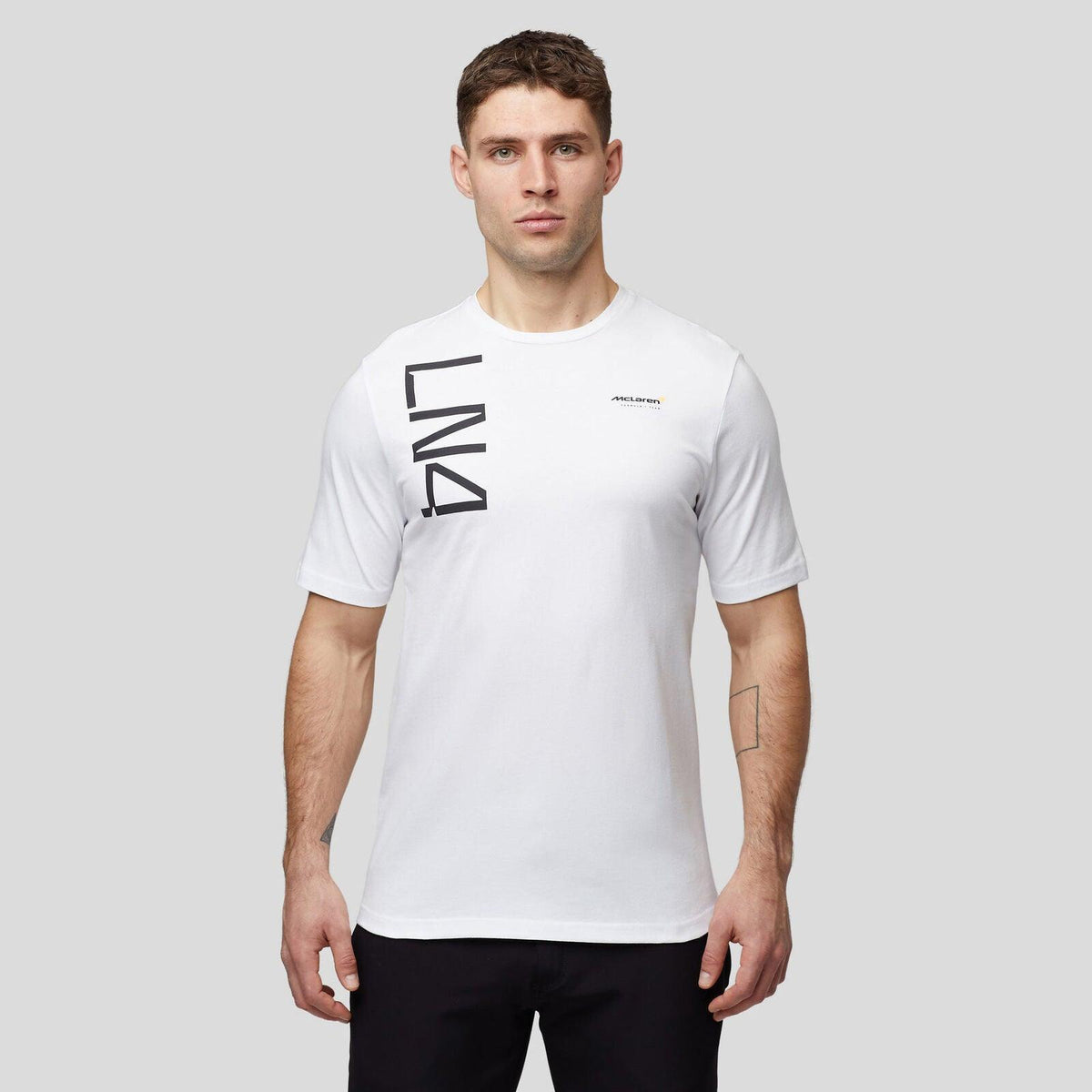 Man wearing a white McLaren F1 Lando Norris Core T-shirt