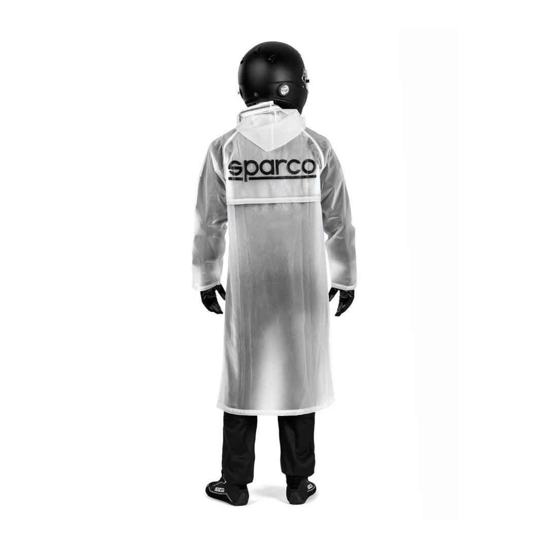 Sparco Raincoat Evo waterproof karting jacket worn by a racer in a black helmet.